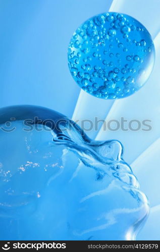 Low angle view of a glass paperweight and a glass mannequin