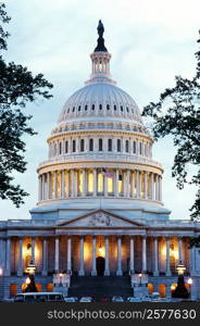 Low angle view of a government building lit up at dusk, Capitol Building, Washington DC, USA