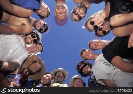 Low angle view of a group of people standing in a circle