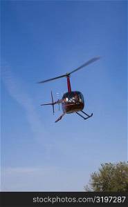 Low angle view of a helicopter flying, Orlando, Florida, USA