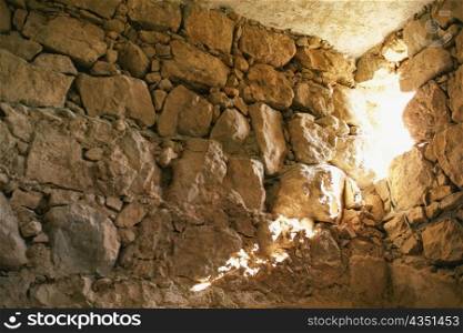 Low angle view of a hole in a stone wall, Masada, Israel