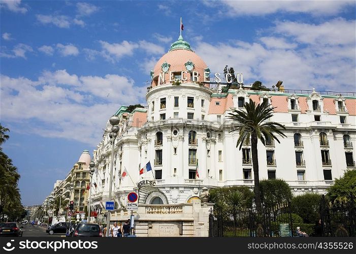 Low angle view of a hotel at the roadside, Hotel Negresco, Promenade des Anglais, Nice, France