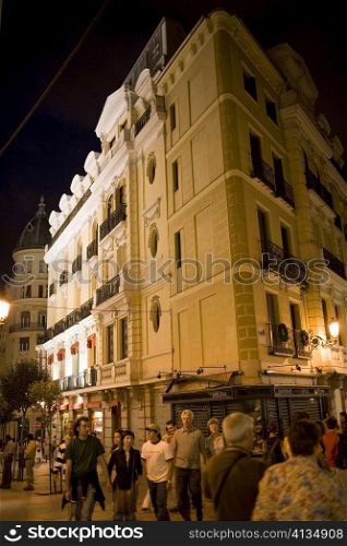 Low angle view of a hotel lit up at night, Madrid, Spain