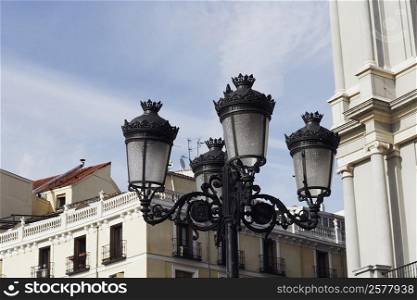 Low angle view of a lamppost in front of a building, Madrid, Spain