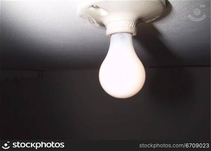 Low angle view of a light bulb lit up