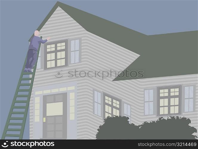 Low angle view of a man standing on a ladder