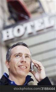 Low angle view of a mature man talking on a mobile phone