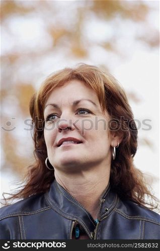 Low angle view of a mature woman looking away