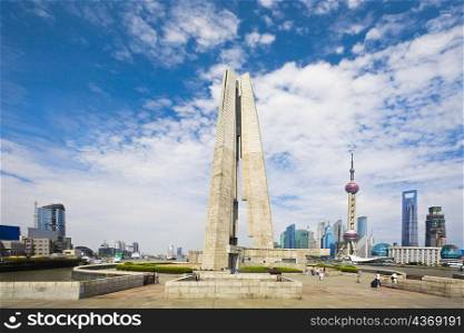 Low angle view of a museum with a tower in the background, Shanghai Monument to People&acute;s Heroes, Huangpu Park, The Bund, Shanghai, China