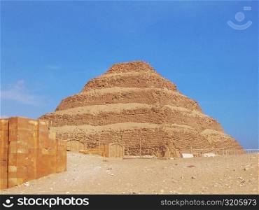 Low angle view of a pyramid in an arid landscape, The Step Pyramid Of Zoser, Saqqara, Egypt