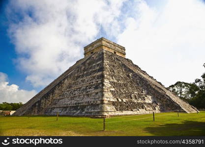 Low angle view of a pyramid on a landscape, Chichen Itza, Yucatan, Mexico