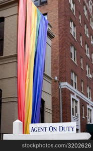 Low angle view of a rainbow flag hanging on a building