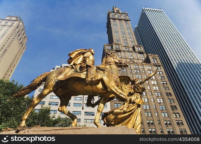 Low angle view of a sculpture with skyscrapers, New York City, New York State, USA