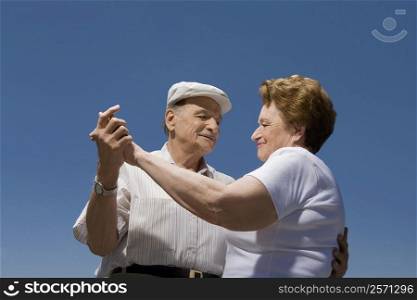 Low angle view of a senior couple dancing