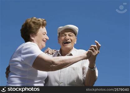 Low angle view of a senior couple dancing