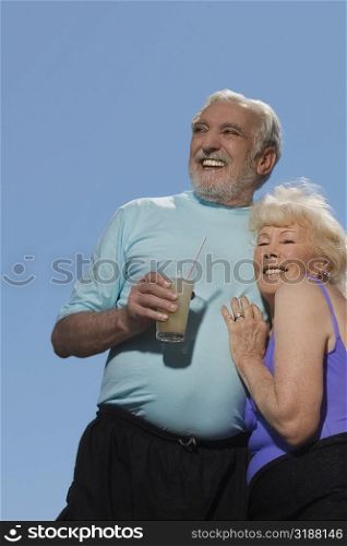 Low angle view of a senior couple embracing each other