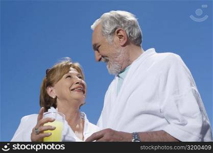 Low angle view of a senior couple looking at each other and smiling