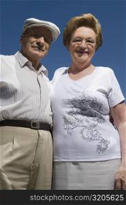 Low angle view of a senior couple smiling