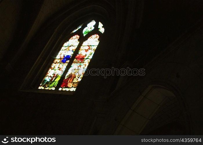 Low angle view of a stained glass window in a church, Church Of St. Pierre, Bordeaux, Aquitaine, France