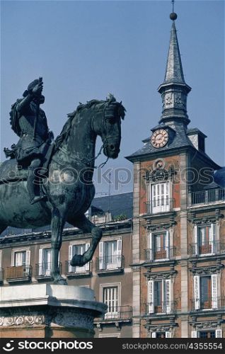 Low angle view of a statue in front of a building, Statue Of Philip III, Madrid, Spain