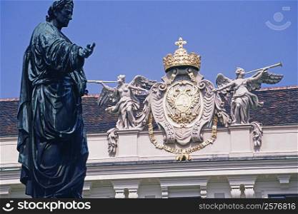 Low angle view of a statue in front of a palace, Hofburg Palace, Vienna, Austria