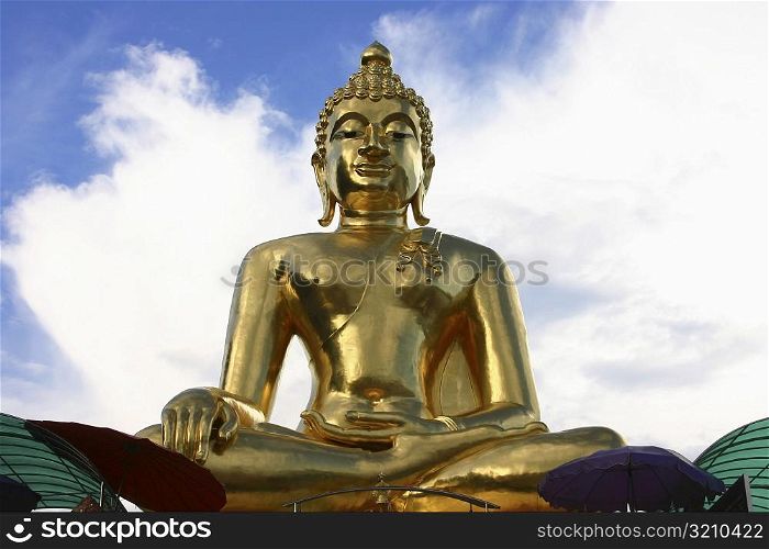 Low angle view of a statue of Buddha, Chiang Mai, Thailand