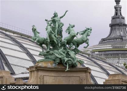Low angle view of a statue on a building, Galeries Nationales du Grand Palais, Paris, France