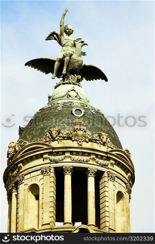 Low angle view of a statue on a dome, Barcelona, Spain