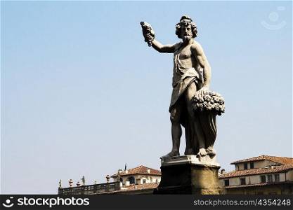 Low angle view of a statue, Ponte Santa Trinita Bridge, Florence, Tuscany, Italy
