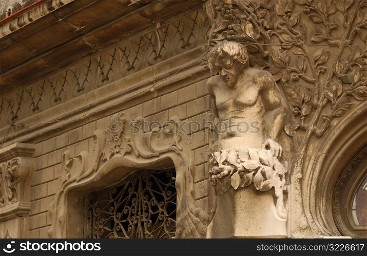 Low angle view of a stone statue mounted on a building, Havana, Cuba