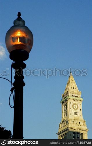 Low angle view of a street light in front of a clock tower, Boston, Massachusetts, USA