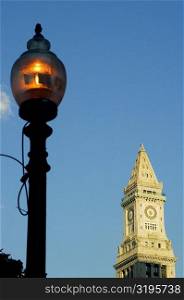 Low angle view of a street light in front of a clock tower, Boston, Massachusetts, USA