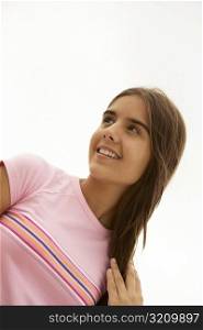 Low angle view of a teenage girl smiling
