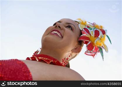 Low angle view of a teenage girl wearing a costume in a traditional festival