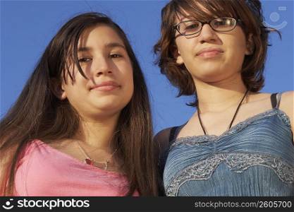 Low angle view of a teenage girl with her sister