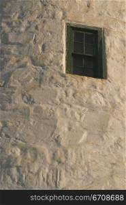 Low angle view of a window on a wall