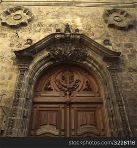 Low angle view of a wooden carved door of a church, Havana, Cuba