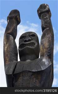 Low angle view of a wooden statue, Ahuena Heiau, Kailua-Kona, Kona, Big Island, Hawaii Islands, USA