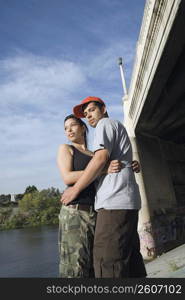 Low angle view of a young couple embracing each other