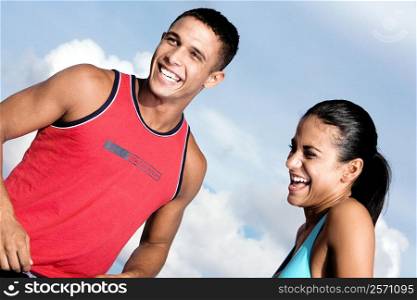 Low angle view of a young couple laughing