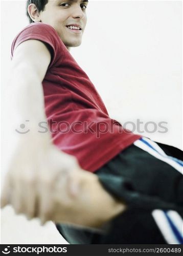 Low angle view of a young man exercising