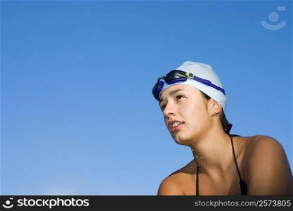 Low angle view of a young woman in swimwear