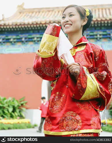 Low angle view of a young woman in the traditional clothing