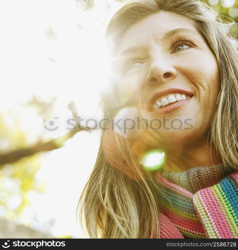 Low angle view of a young woman smiling