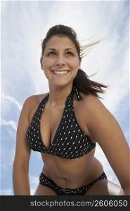 Low angle view of a young woman smiling