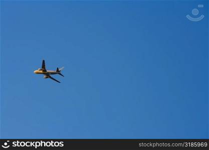 Low angle view of an airplane flying in the sky