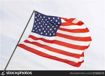 Low angle view of an American flag fluttering, USA