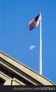 Low angle view of an American flag on a building, Boston, Massachusetts, USA