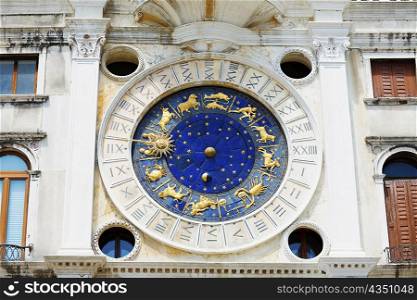 Low angle view of an astrological clock, St. Mark&acute;s Square, Venice, Italy