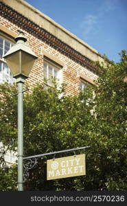 Low angle view of an information board hanging on a lamppost, Savannah, Georgia, USA